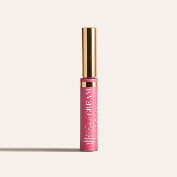 LipSense HydraMatte pink lip color bottle with a tall gold cap on a light beige background