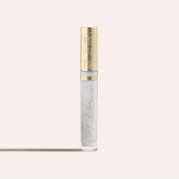 ShadowSense Eyeshadow NZL in a slender clear tube with pale lavender shimmer and a decorative gold cap